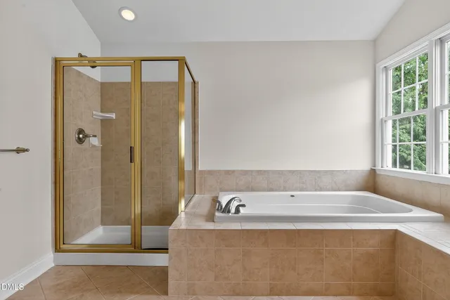 a front view of a house with a yard table and chairs