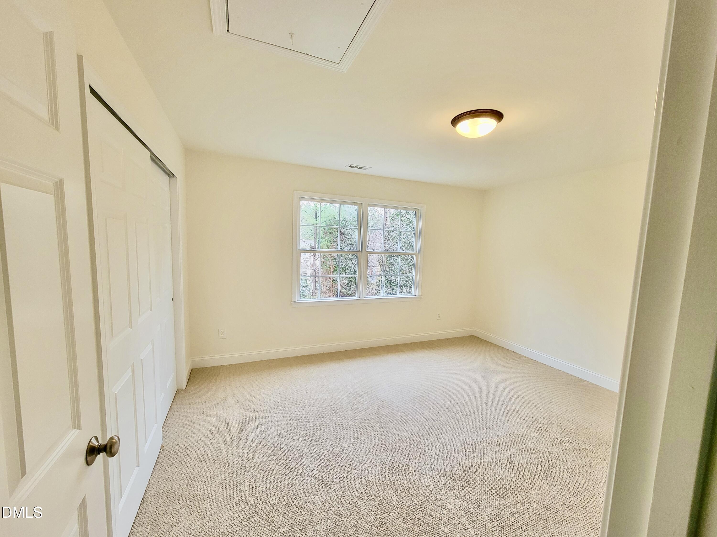 9441 Collingdale Way Raleigh, NC 27617 - Photo 31 of 54 an empty room with windows