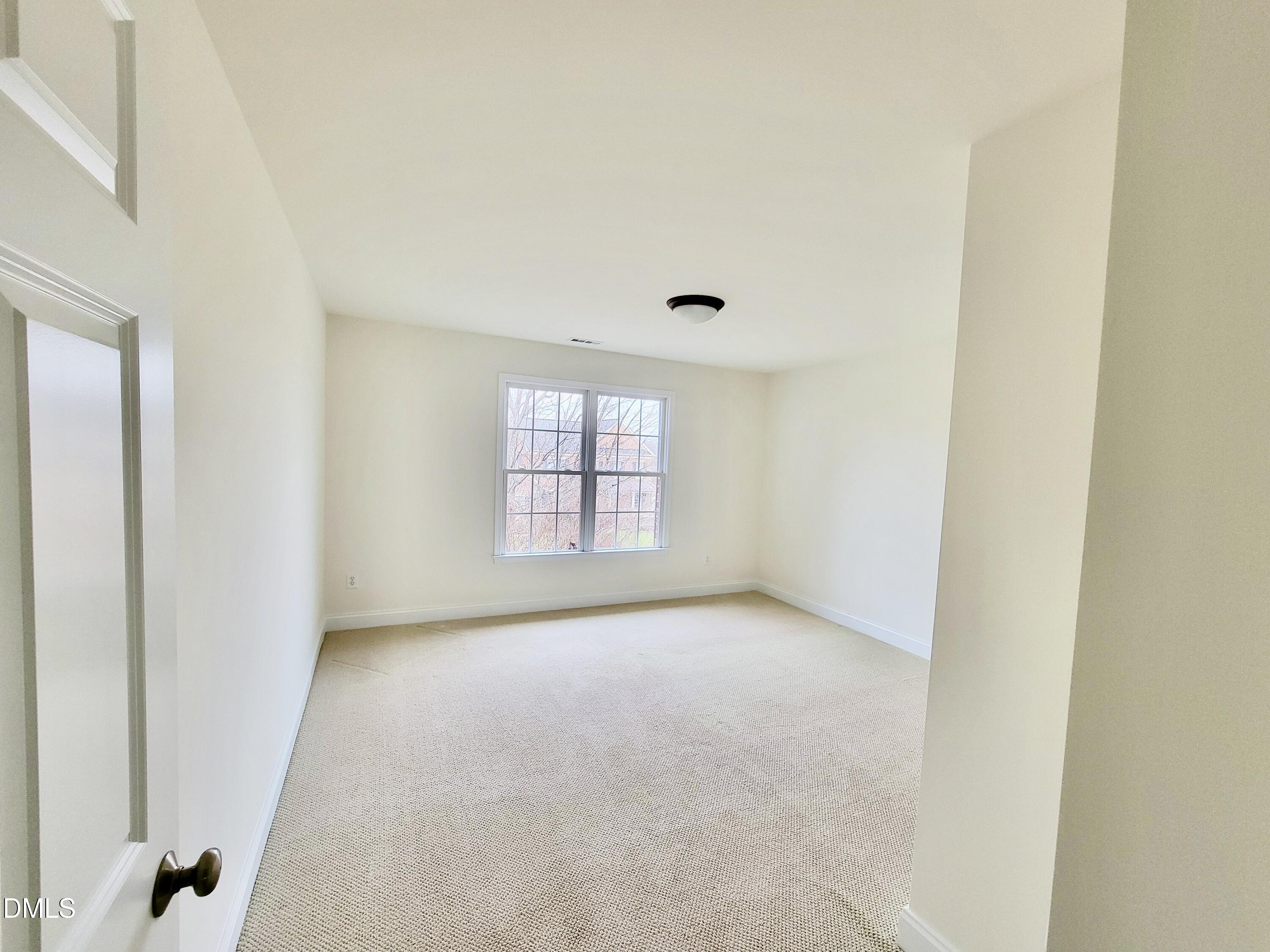 9441 Collingdale Way Raleigh, NC 27617 - Photo 32 of 54 an empty room with windows