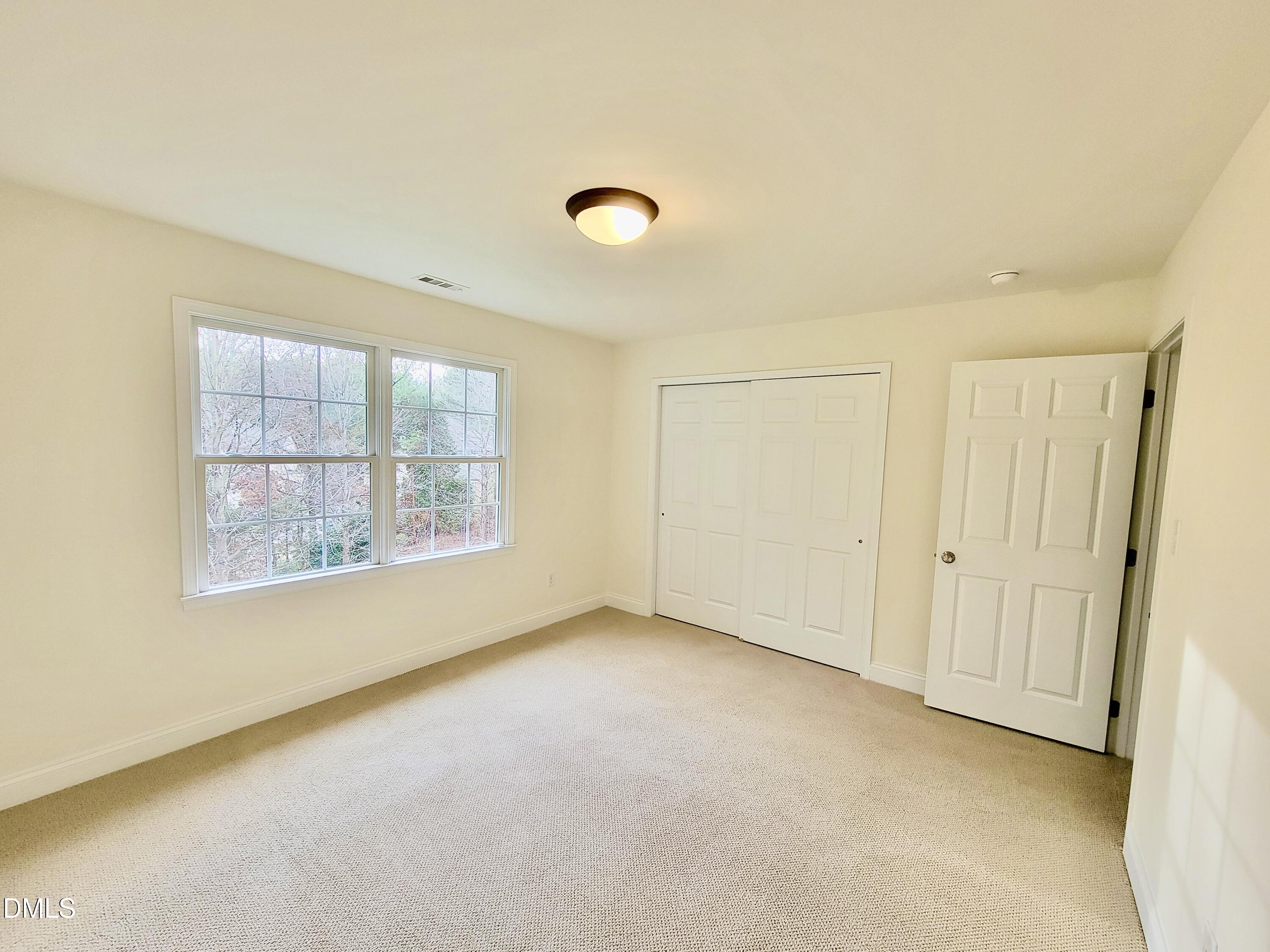 9441 Collingdale Way Raleigh, NC 27617 - Photo 34 of 54 an empty room with windows