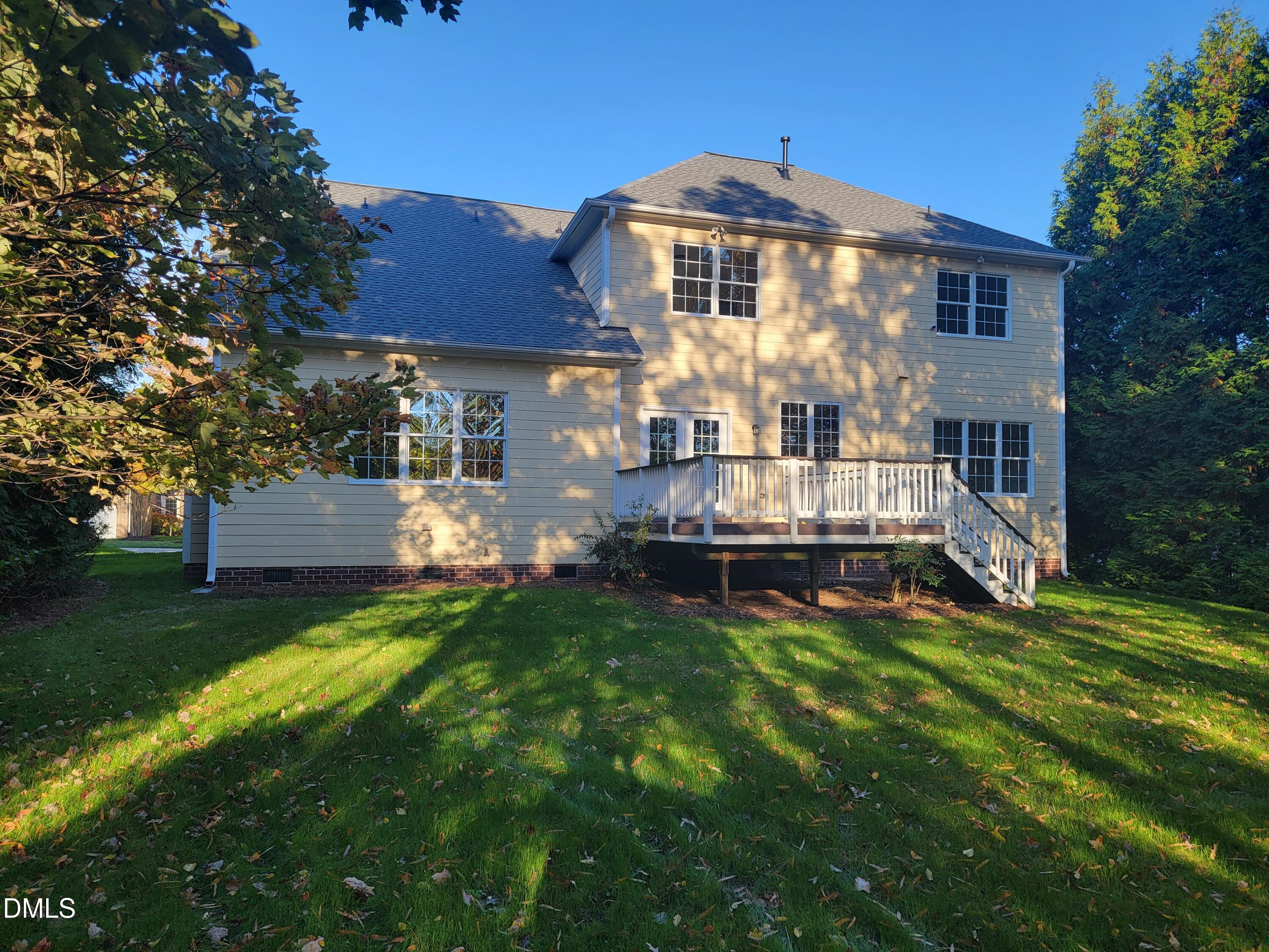 9441 Collingdale Way Raleigh, NC 27617 - Photo 37 of 54 a front view of a house with a yard table and chairs