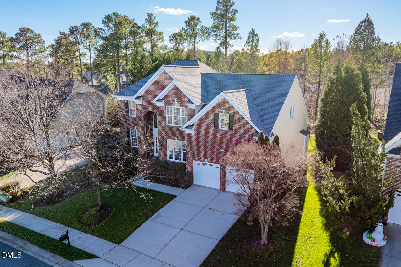 9441 Collingdale Way Raleigh, NC 27617 - Photo 40 of 54 a front view of a house with a garden