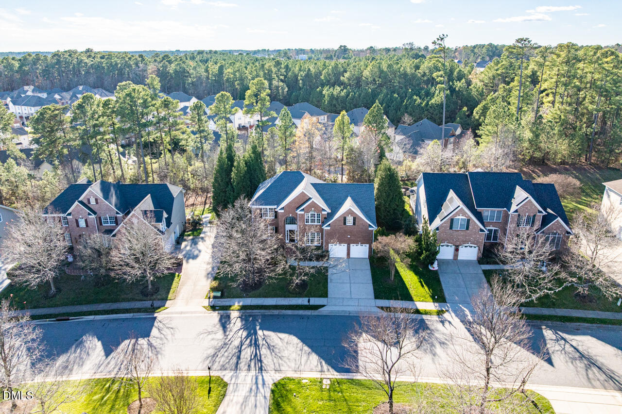 9441 Collingdale Way Raleigh, NC 27617 - Photo 41 of 54 a aerial view of a house with swimming pool and a yard