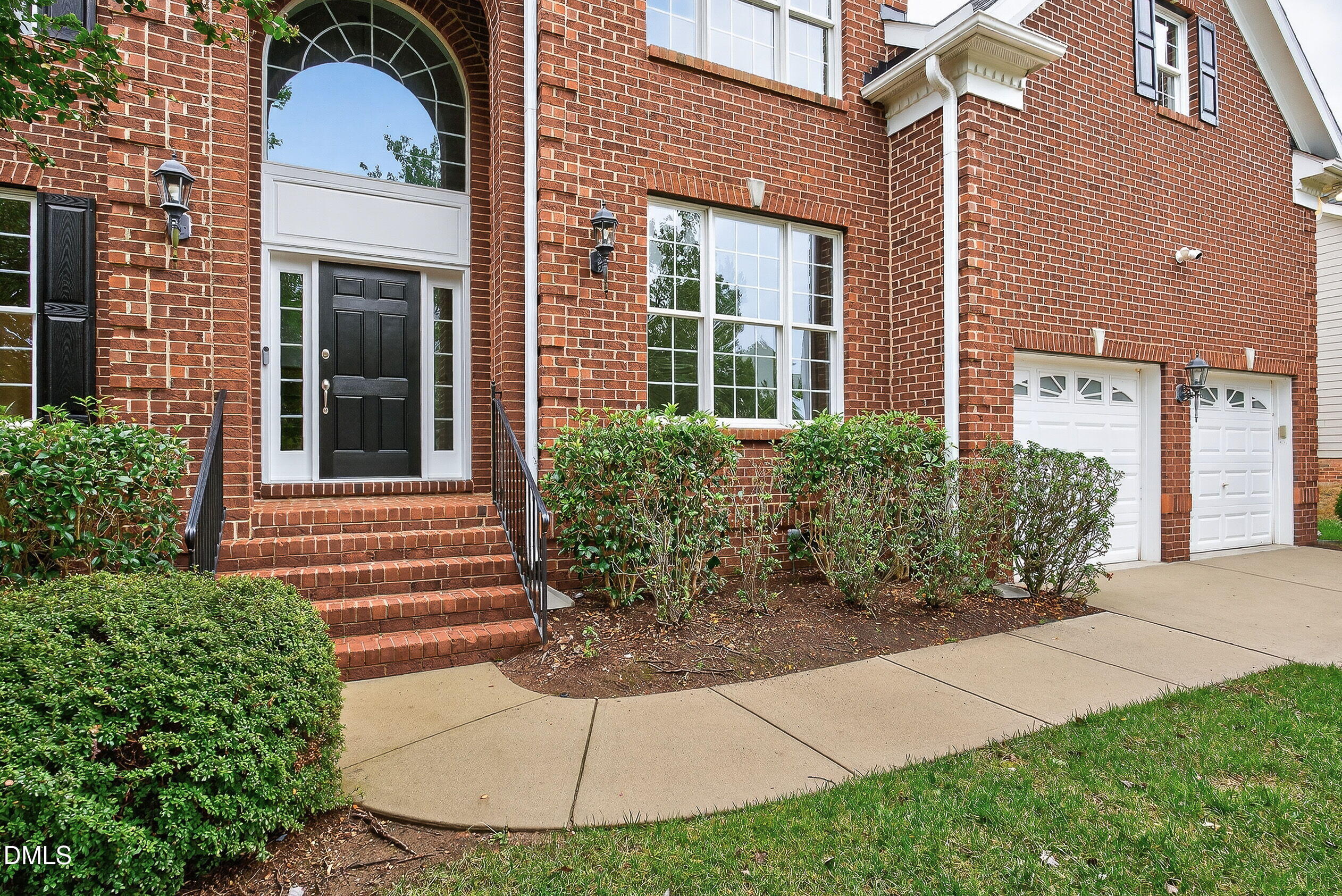9441 Collingdale Way Raleigh, NC 27617 - Photo 4 of 54 a front view of a house with a yard