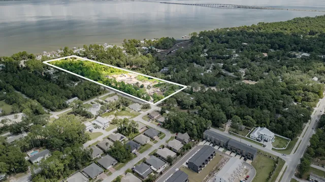 an aerial view of a house with a yard and outdoor seating