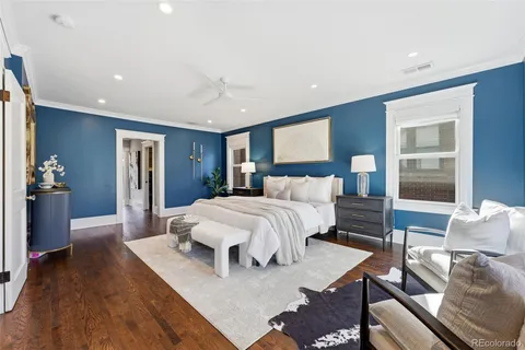 a bedroom with a bed and a couch