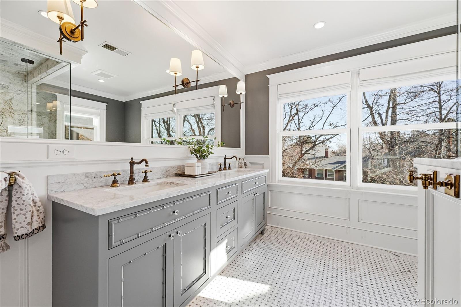 1257 Fillmore Street Denver, CO 80206 - Photo 29 of 50 a bathroom with a granite countertop sink mirror and a large window