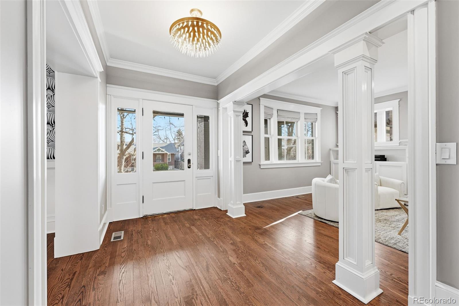 1257 Fillmore Street Denver, CO 80206 - Photo 3 of 50 a view of empty room with wooden floor and fan