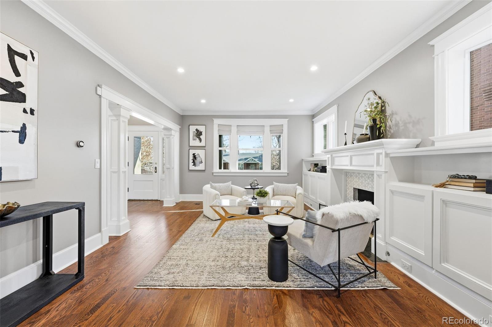 1257 Fillmore Street Denver, CO 80206 - Photo 5 of 50 a living room with furniture and a fireplace