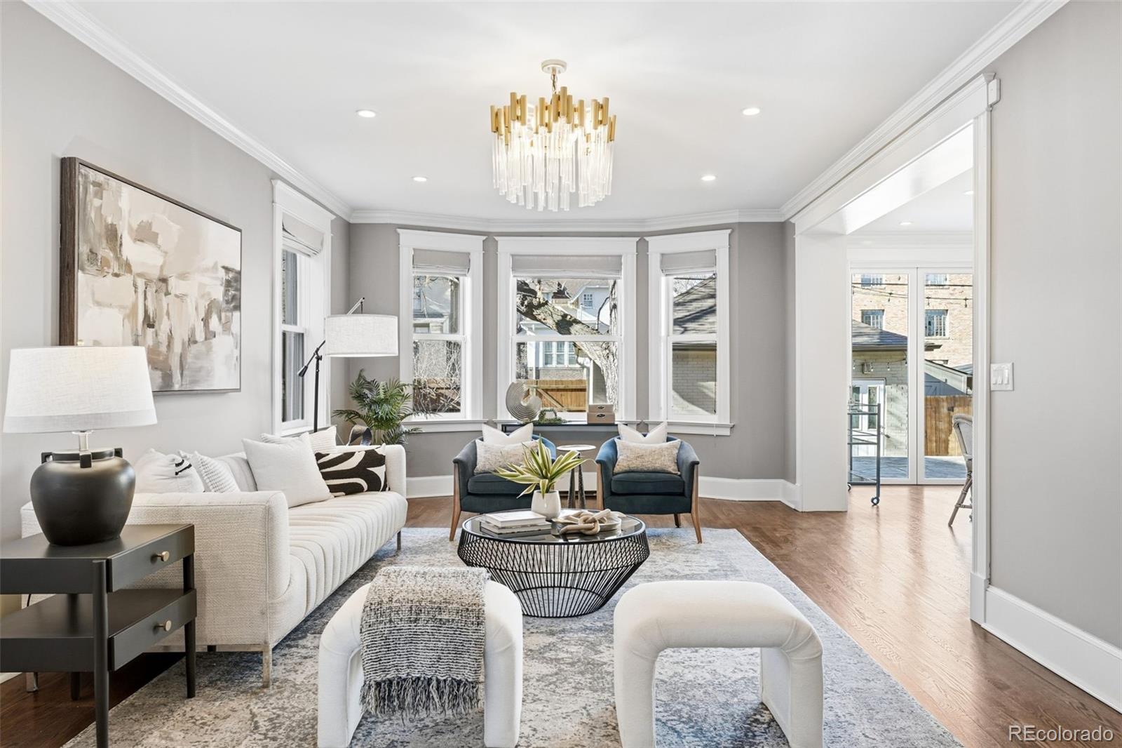 1257 Fillmore Street Denver, CO 80206 - Photo 7 of 50 a living room with fireplace furniture and a large window