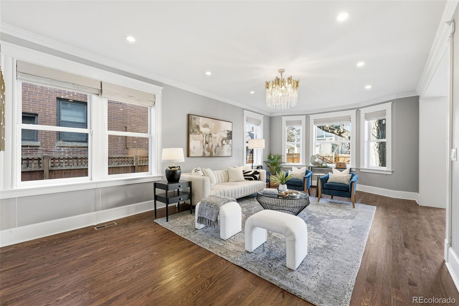 1257 Fillmore Street Denver, CO 80206 - Photo 8 of 50 a living room with furniture and wooden floor