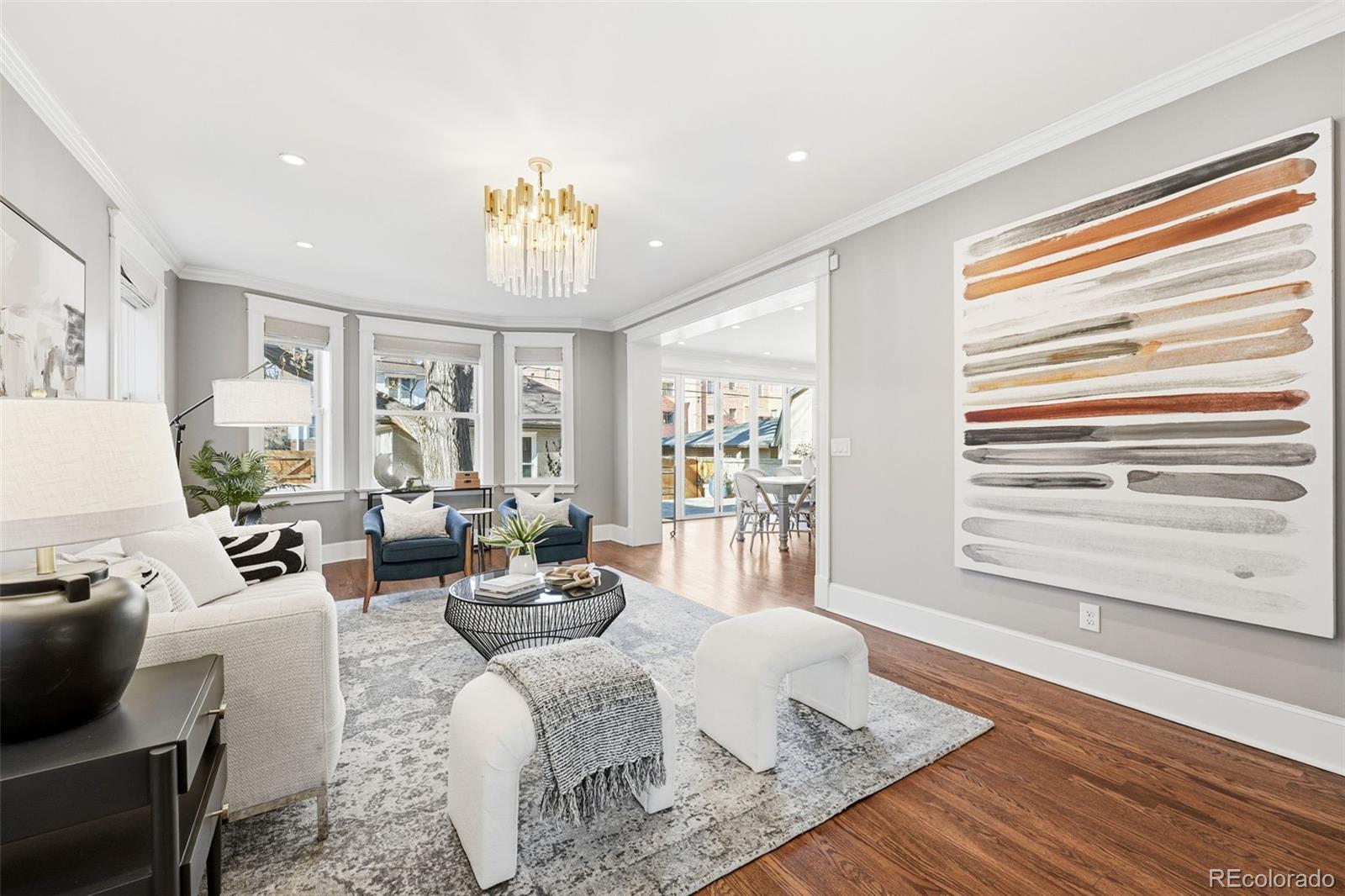 1257 Fillmore Street Denver, CO 80206 - Photo 10 of 50 a living room with furniture and a large window