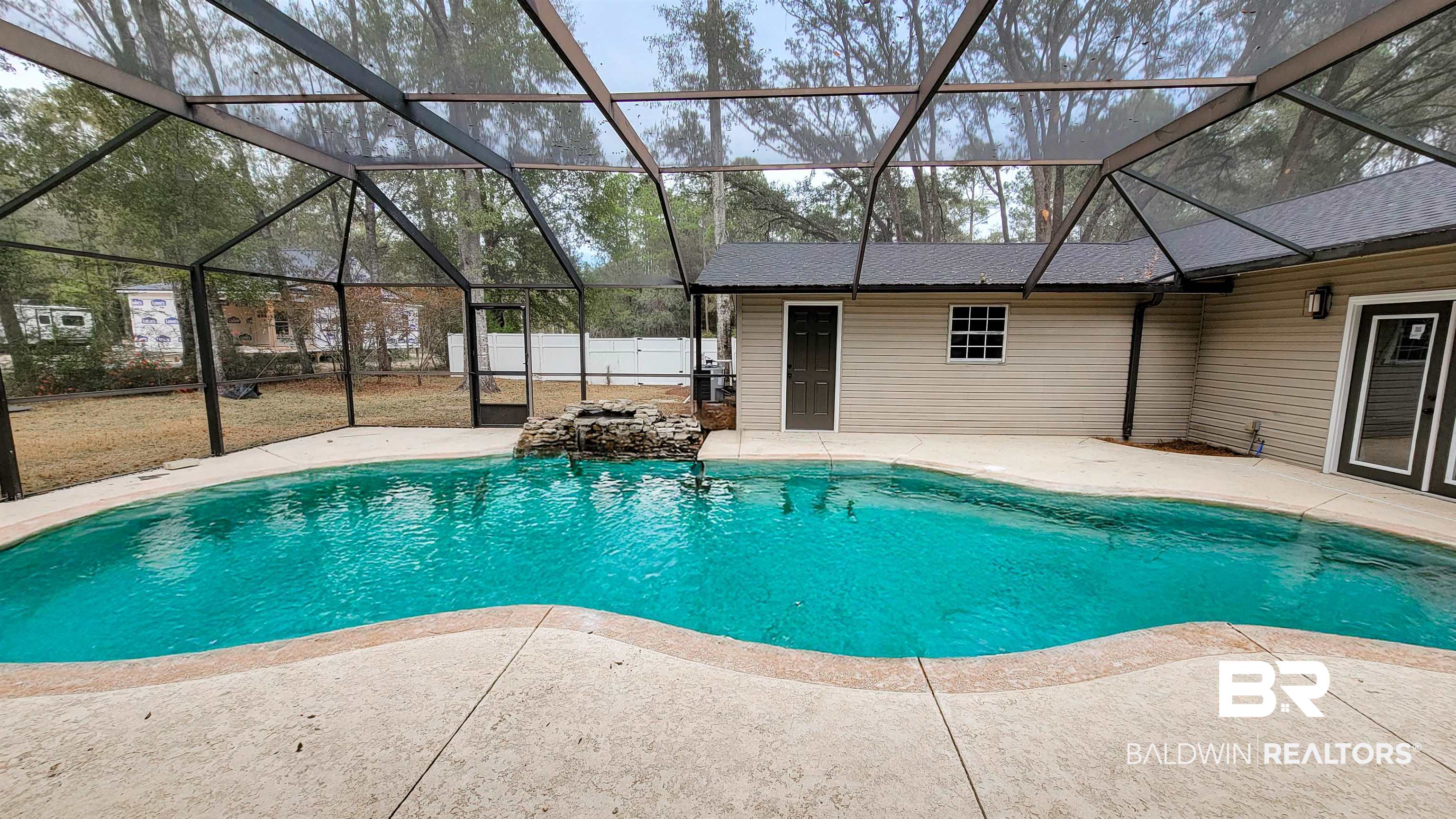 22711 Highway 98 Foley, AL 36535 - Photo 48 of 74 Outdoor pool featuring glass enclosure, a sunroom, and a patio area