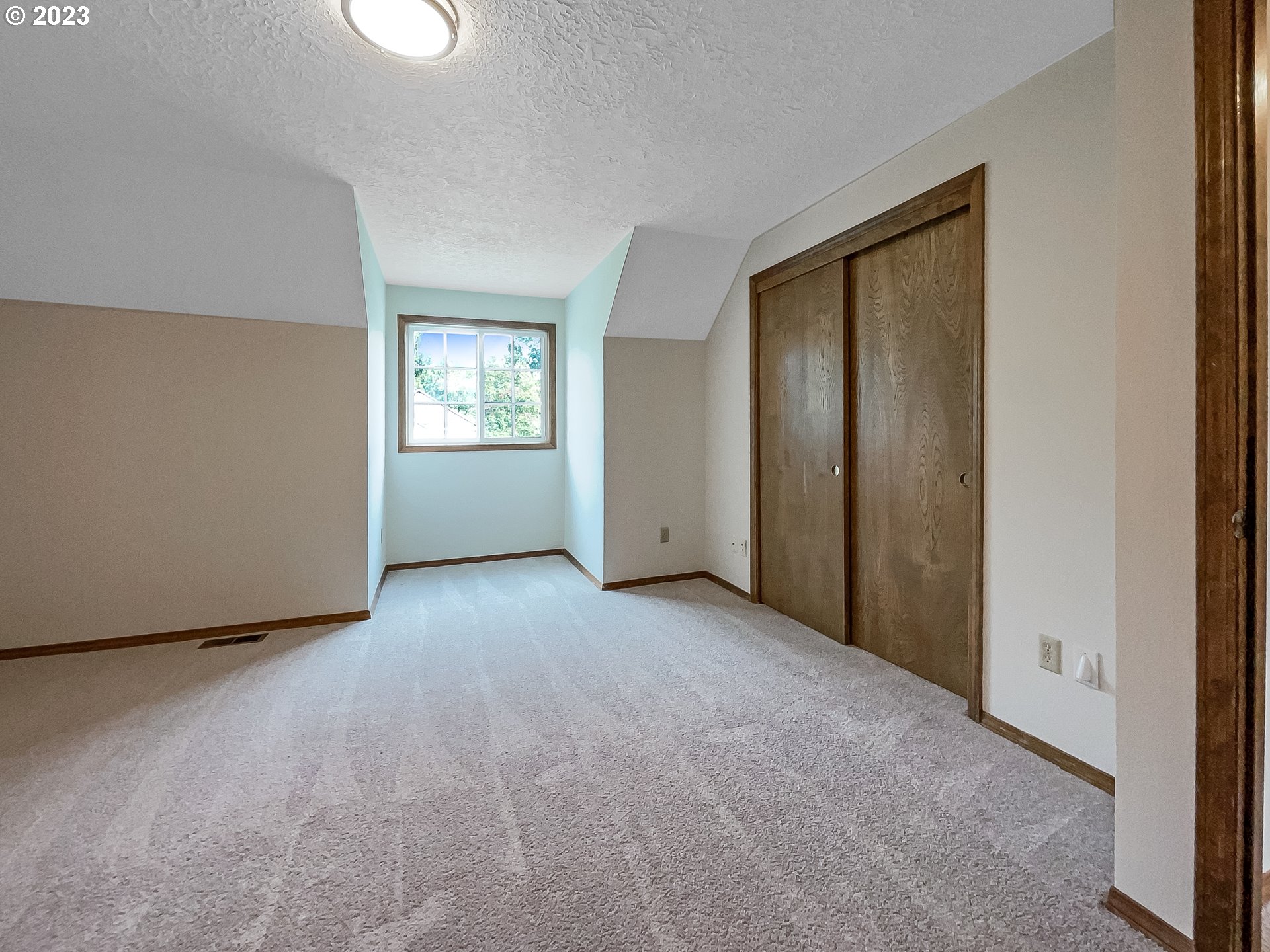 2120 Southwest 30th Drive Gresham, OR 97080 - Photo 11 of 17 an empty room with windows and closet