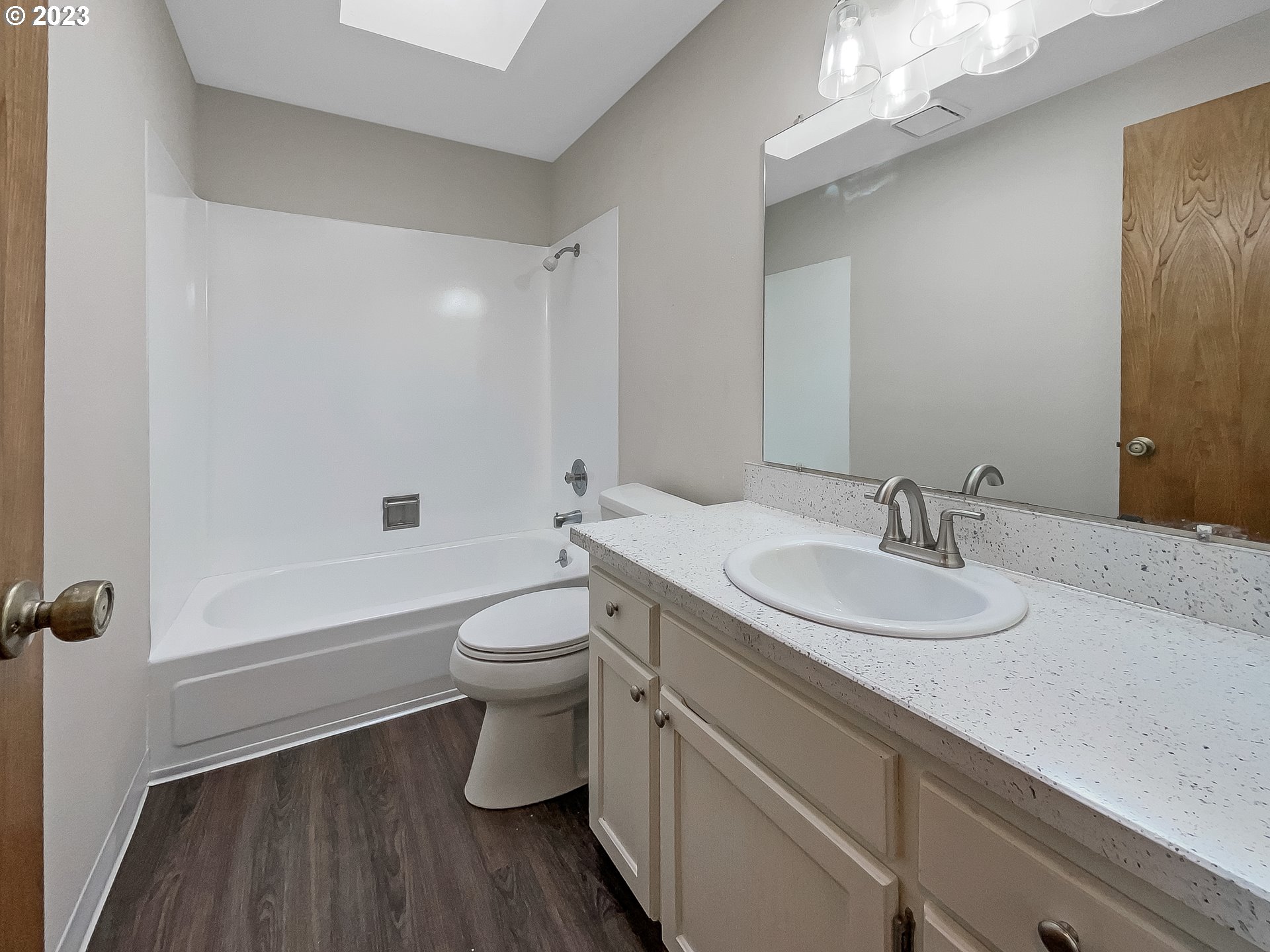 2120 Southwest 30th Drive Gresham, OR 97080 - Photo 12 of 17 a bathroom with a granite countertop toilet a sink and a mirror