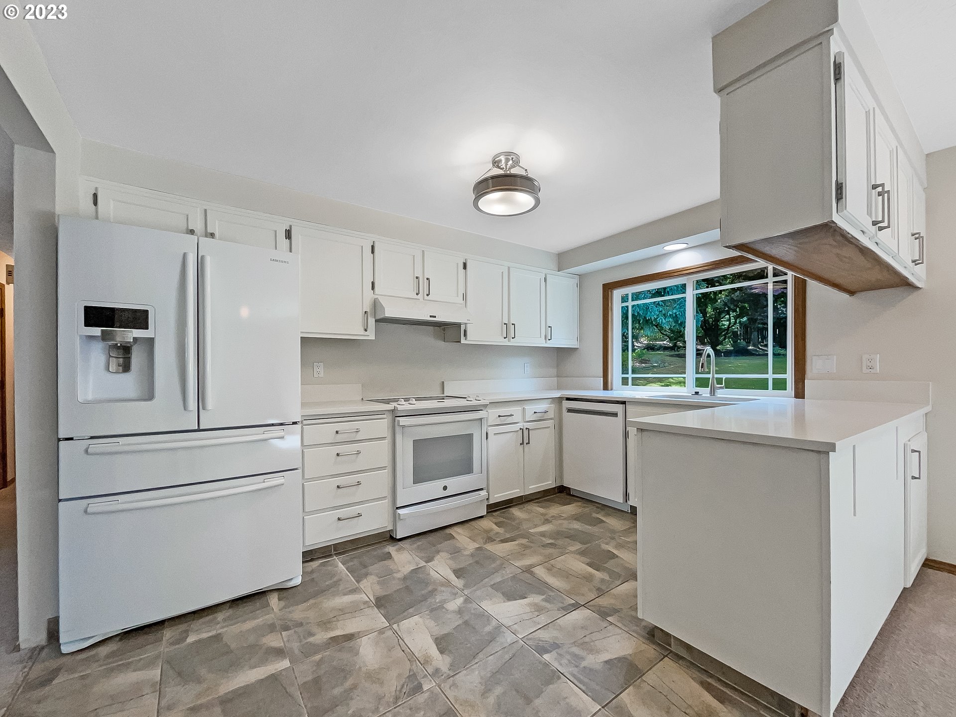 2120 Southwest 30th Drive Gresham, OR 97080 - Photo 6 of 17 a kitchen with granite countertop white cabinets and white stainless steel appliances