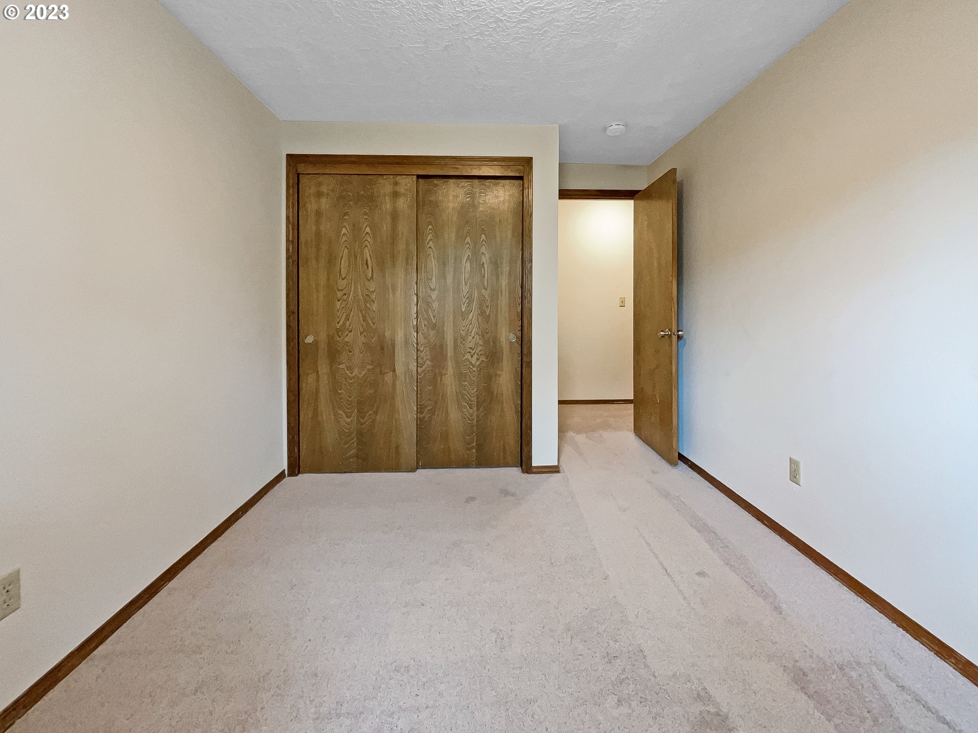 2120 Southwest 30th Drive Gresham, OR 97080 - Photo 9 of 17 a view of an empty room with closet and a window