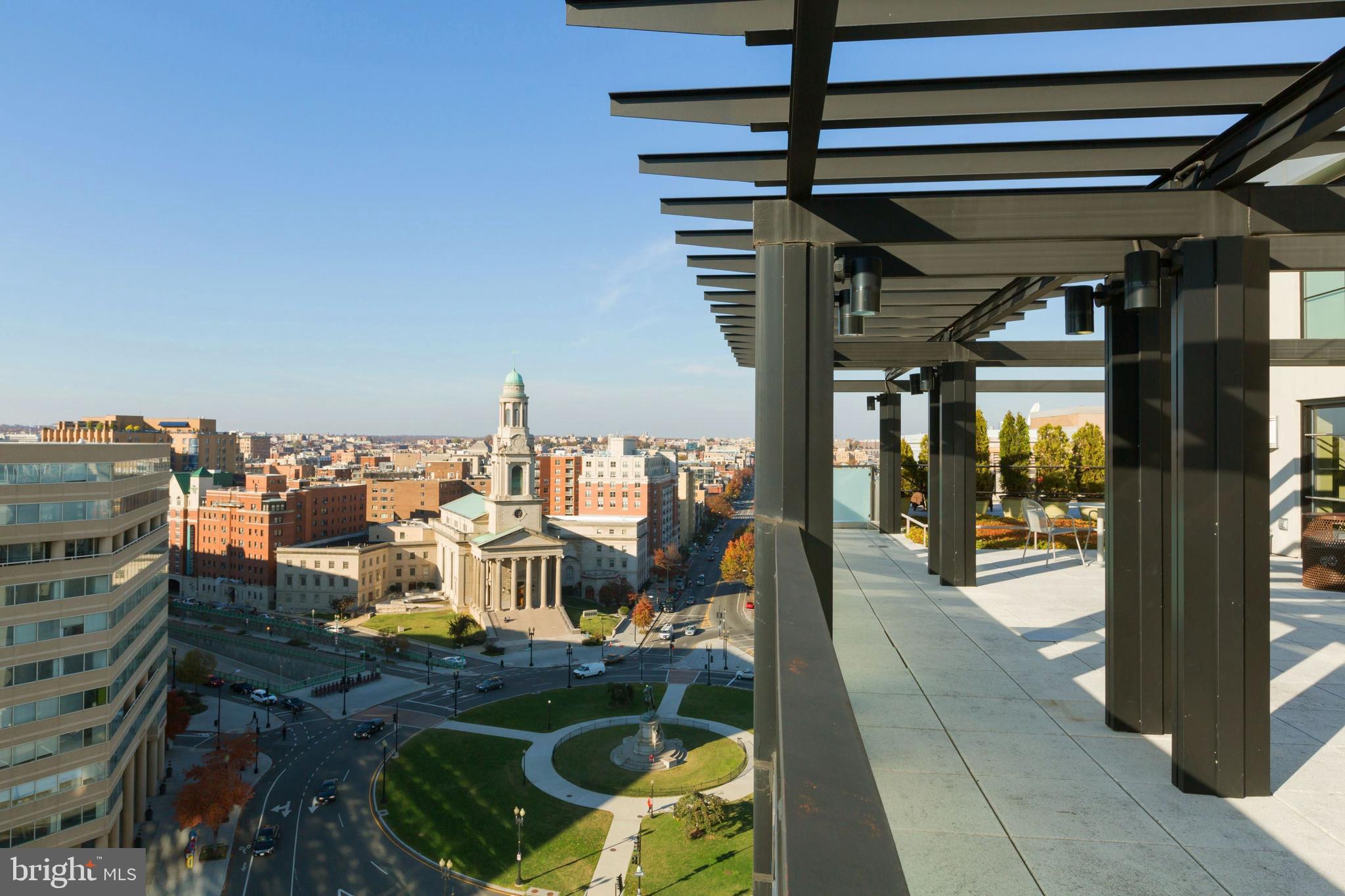 1133 14th Street Northwest, Unit 809 Washington, DC 20005 - Photo 19 of 27 a view of a balcony with chairs