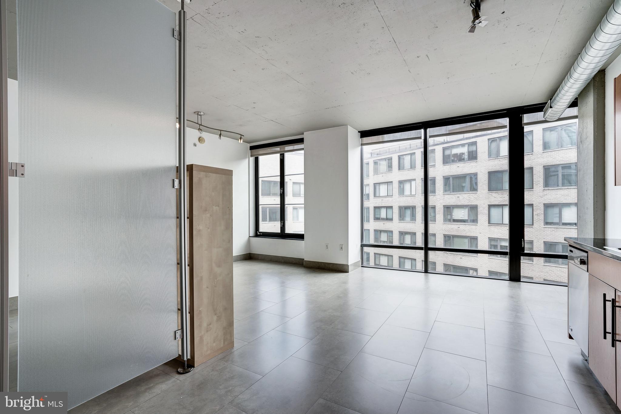 1133 14th Street Northwest, Unit 809 Washington, DC 20005 - Photo 3 of 27 a view of an empty room with a window