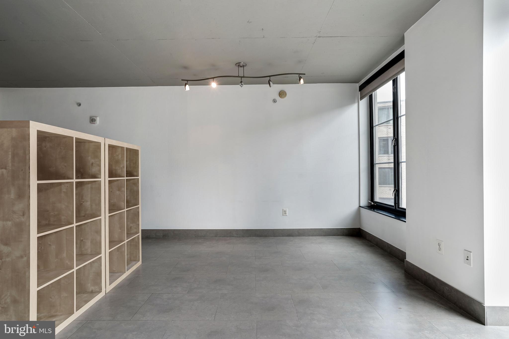 1133 14th Street Northwest, Unit 809 Washington, DC 20005 - Photo 8 of 27 an empty room with windows