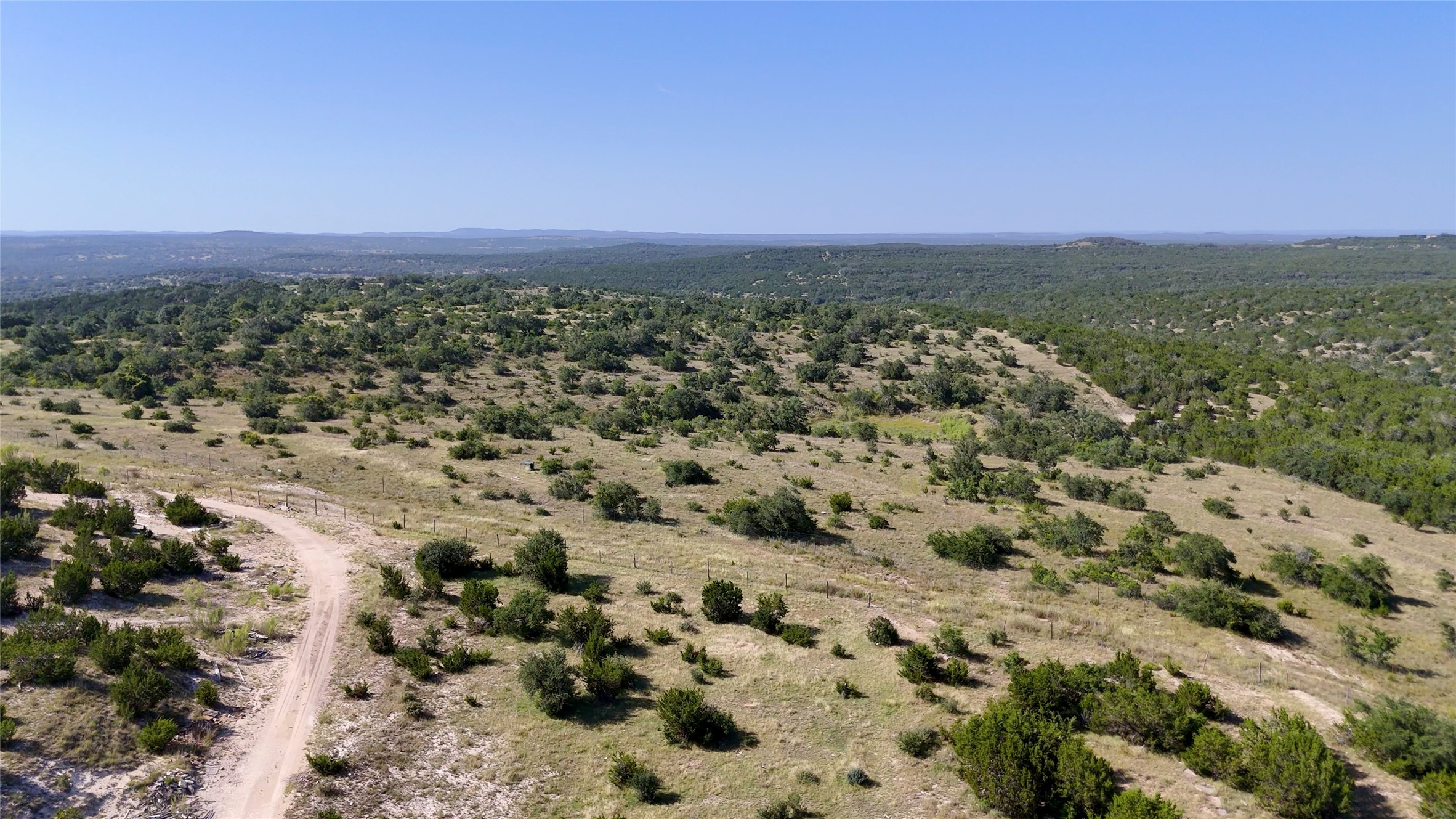 8364 West Fitzhugh Road Dripping Springs, TX 78620 - Photo 5 of 14 an aerial view of a houses with a yard