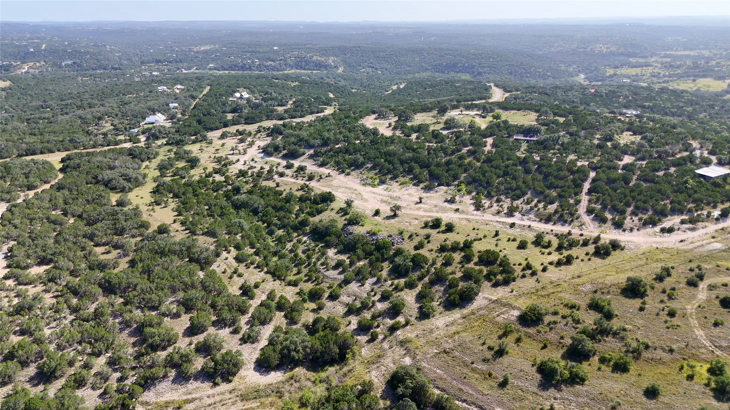 8364 West Fitzhugh Road Dripping Springs, TX 78620 - Photo 6 of 14 an aerial view of mountain with yard and mountain view in back