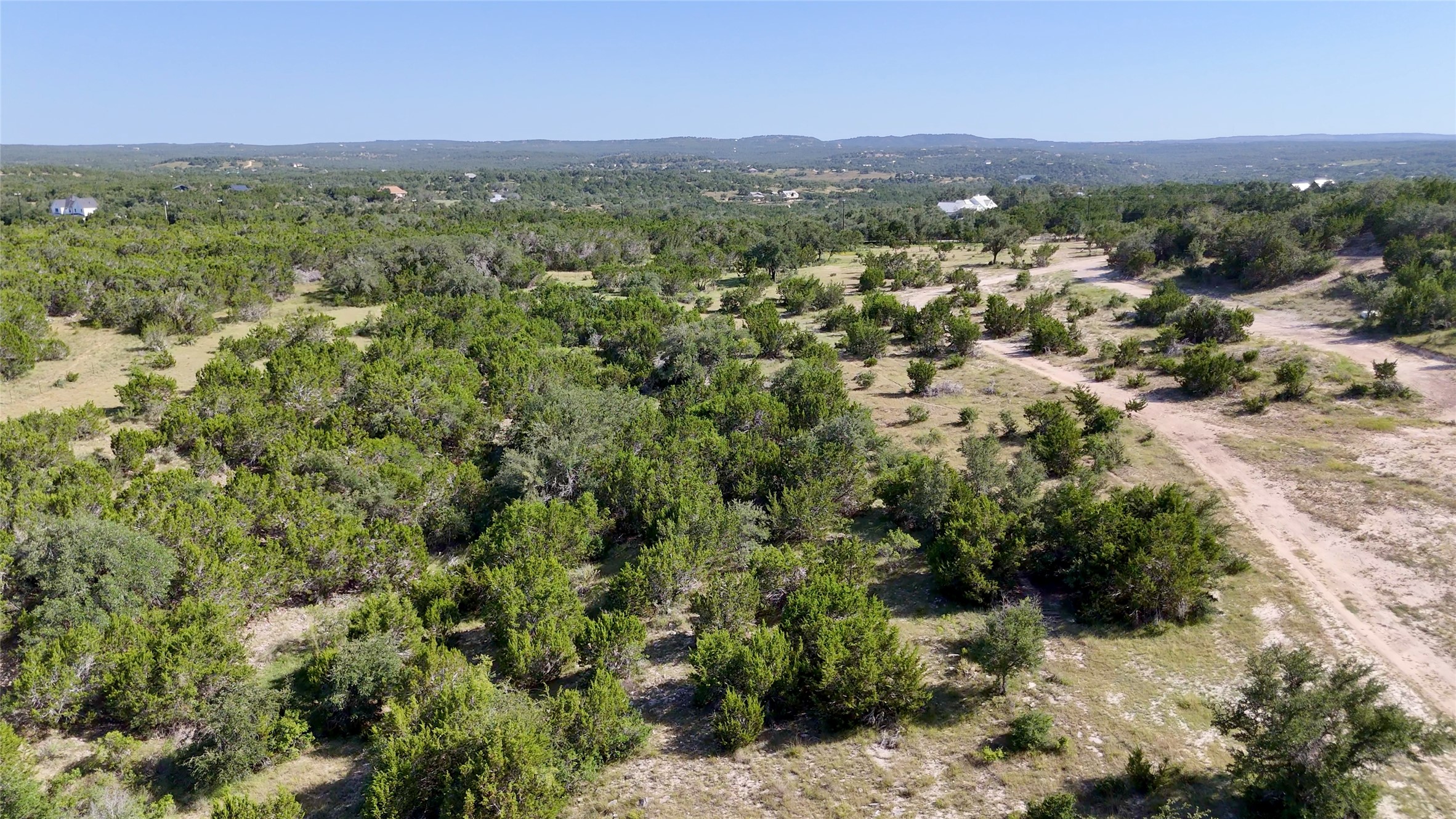 8364 West Fitzhugh Road Dripping Springs, TX 78620 - Photo 9 of 14 a view of a city with lush green forest
