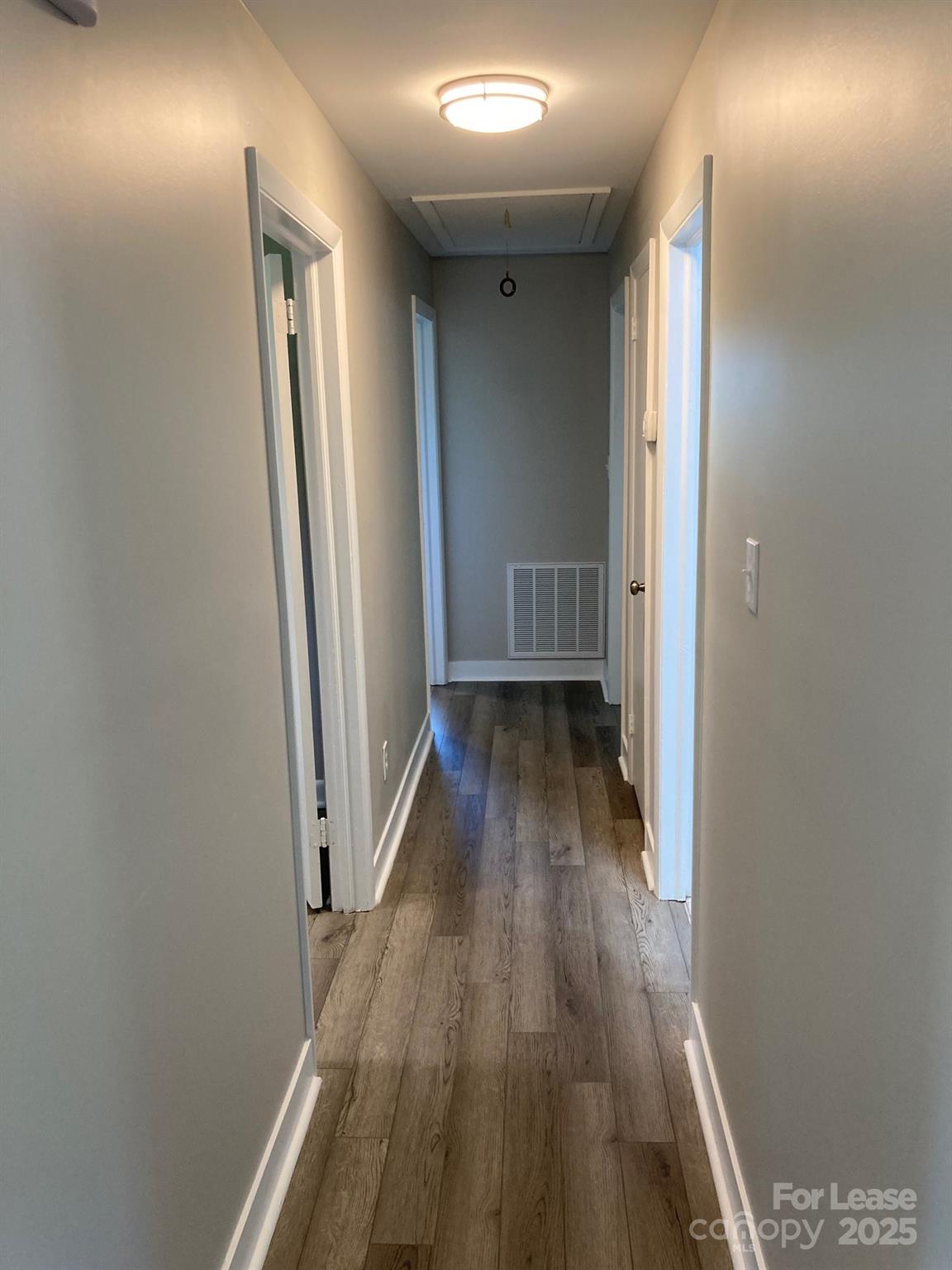 1697 Morningside Drive Newton, NC 28658 - Photo 13 of 22 a view of a hallway with wooden floor