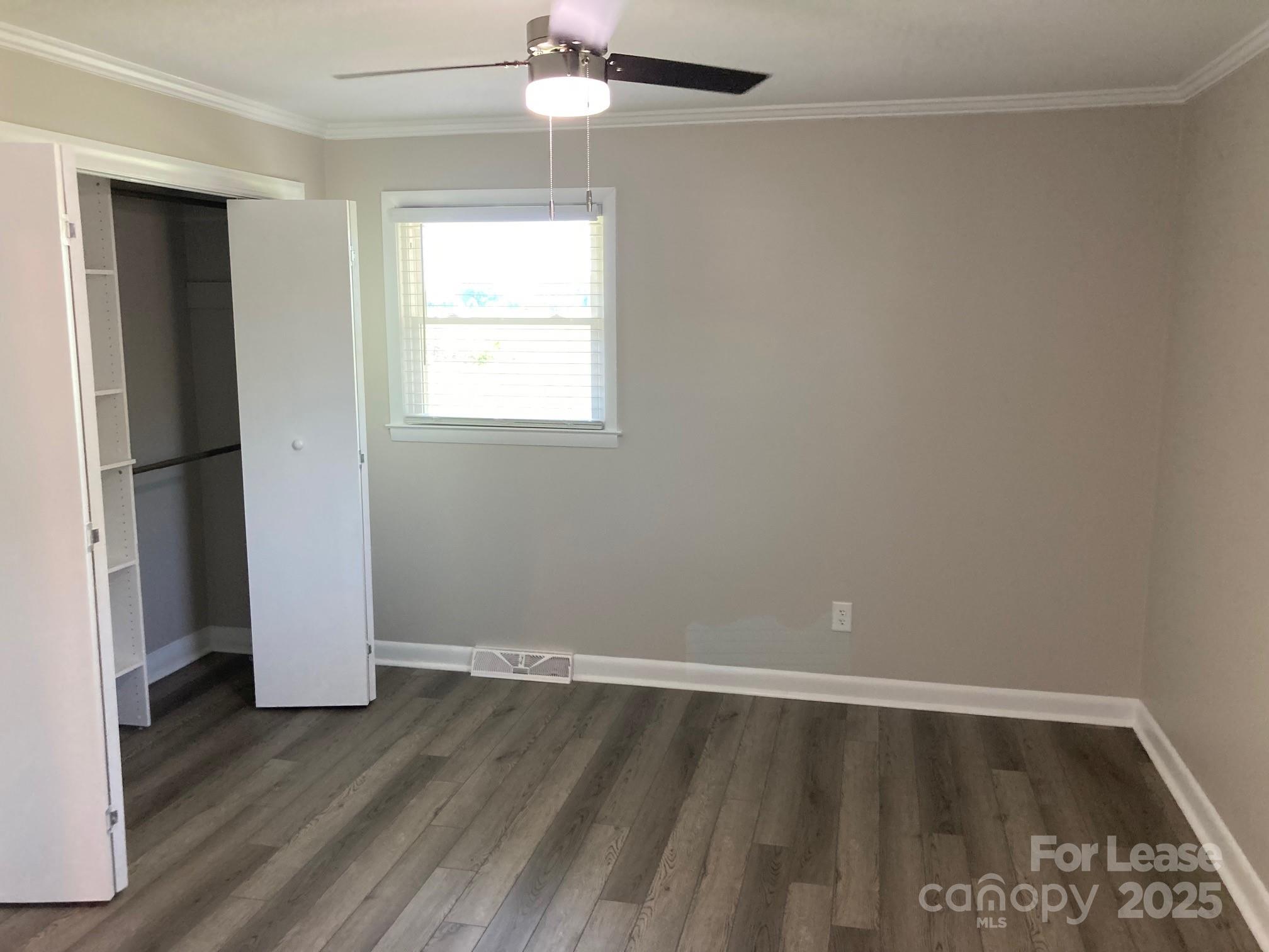 1697 Morningside Drive Newton, NC 28658 - Photo 19 of 22 wooden floor in an empty room with a window