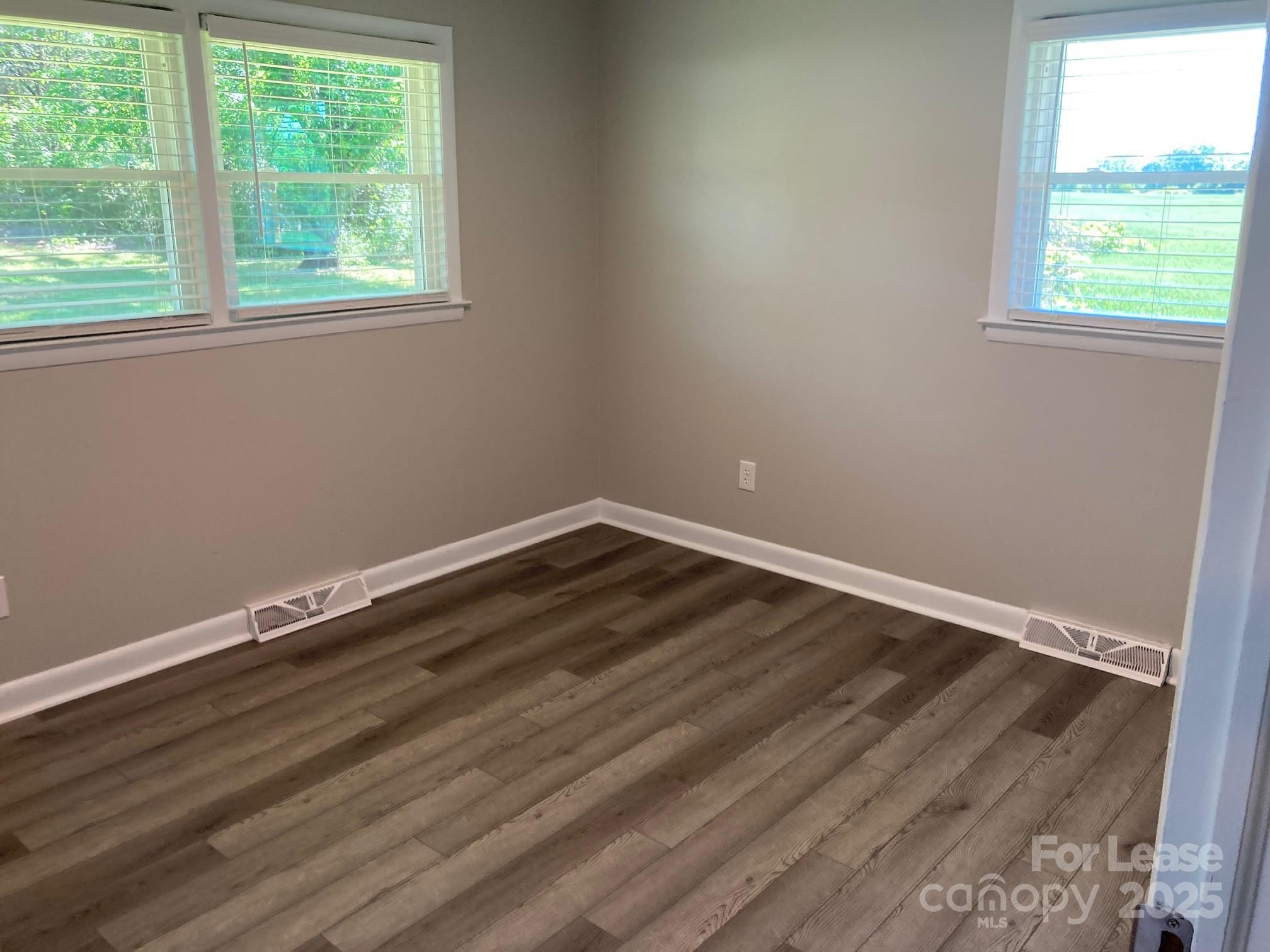1697 Morningside Drive Newton, NC 28658 - Photo 21 of 22 a room with wooden floor and window