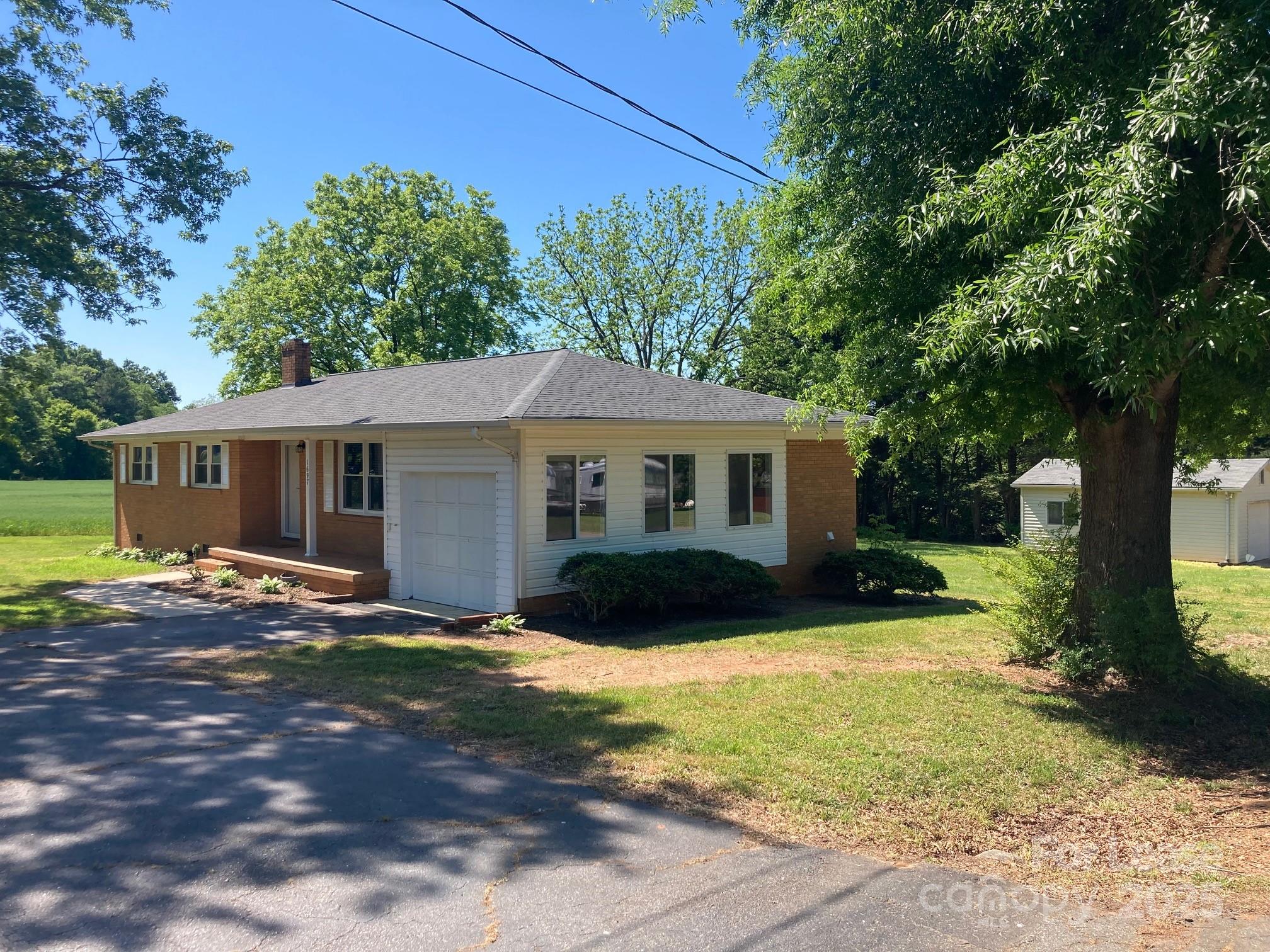 1697 Morningside Drive Newton, NC 28658 - Photo 3 of 22 a view of a house with a yard