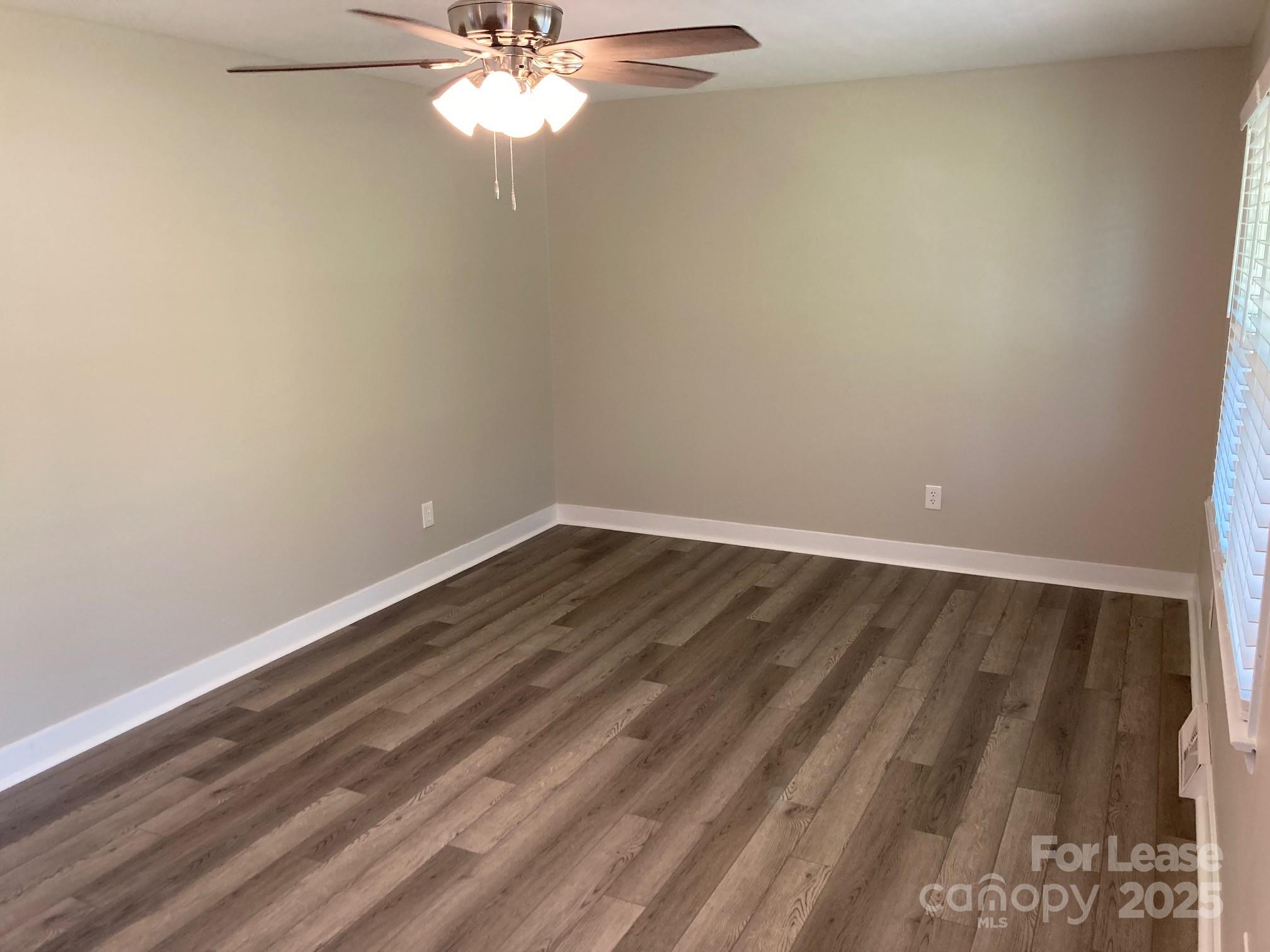 1697 Morningside Drive Newton, NC 28658 - Photo 7 of 22 a view of a room with wooden floor and fan