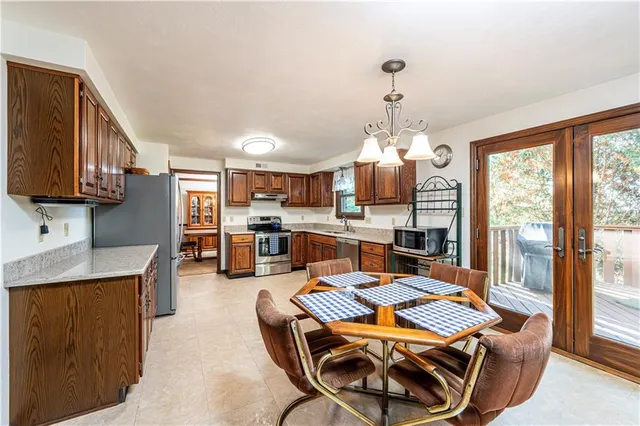 a living room with lots of furniture and kitchen view