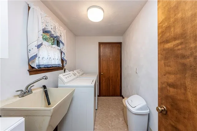 a bathroom with a toilet sink and tub