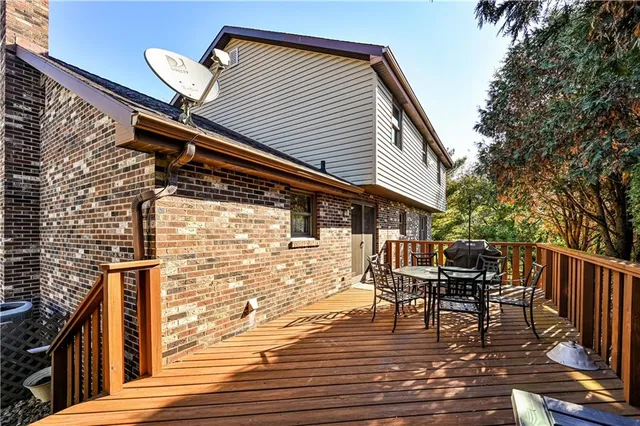 a balcony view with a seating space