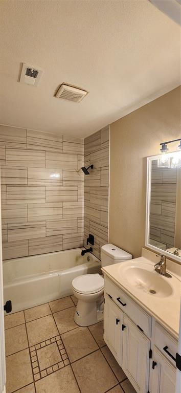 2821 Windy Drive Commerce, TX 75428 - Photo 10 of 25 a bathroom with a granite countertop sink a toilet a mirror and shower