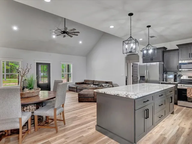 a kitchen that has a lot of cabinets in it