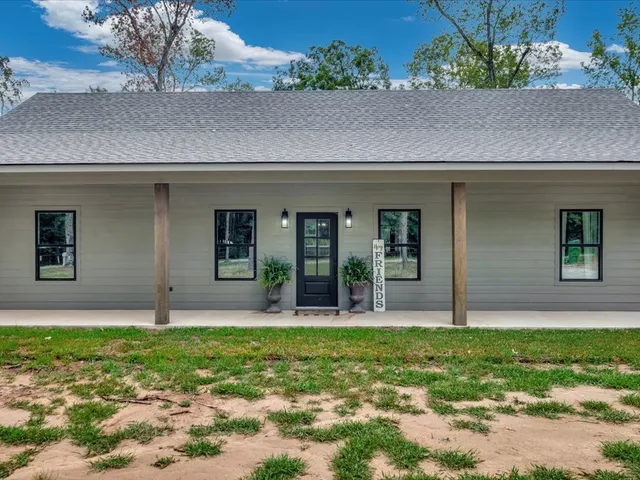 a house view with a garden space