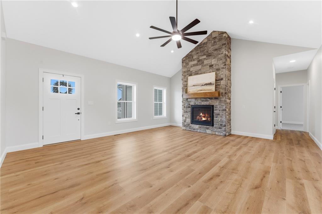 16 Margaret Street Uniontown, PA 15401 - Photo 18 of 50 a view of empty room with wooden floor and fireplace