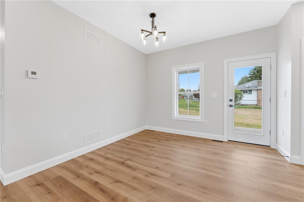 16 Margaret Street Uniontown, PA 15401 - Photo 32 of 50 wooden floor in an empty room with a window