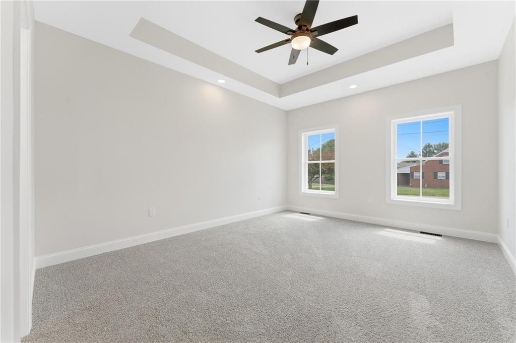 16 Margaret Street Uniontown, PA 15401 - Photo 33 of 50 an empty room with windows and fan