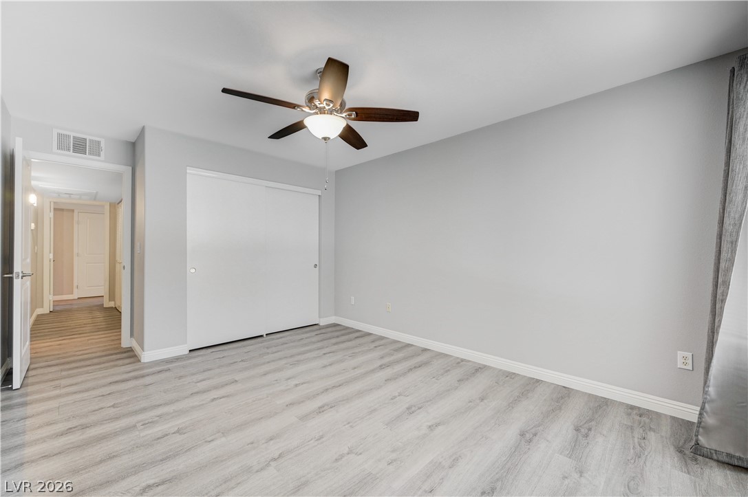 3425 East Russell Road, Unit 223 Las Vegas, NV 89120 - Photo 30 of 47 A streamlined bedroom offering quiet repose with durable, easy-care flooring.