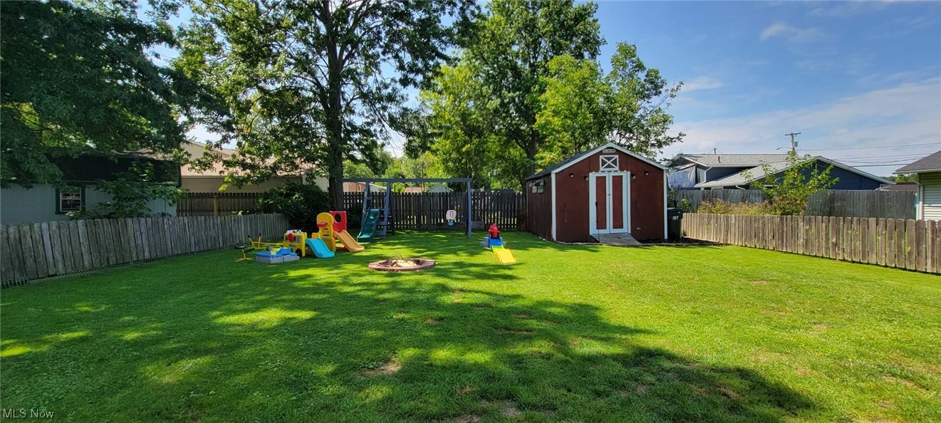 5770 Jaycox Road North Ridgeville, OH 44039 - Photo 22 of 31 View of yard with a shed and a playground