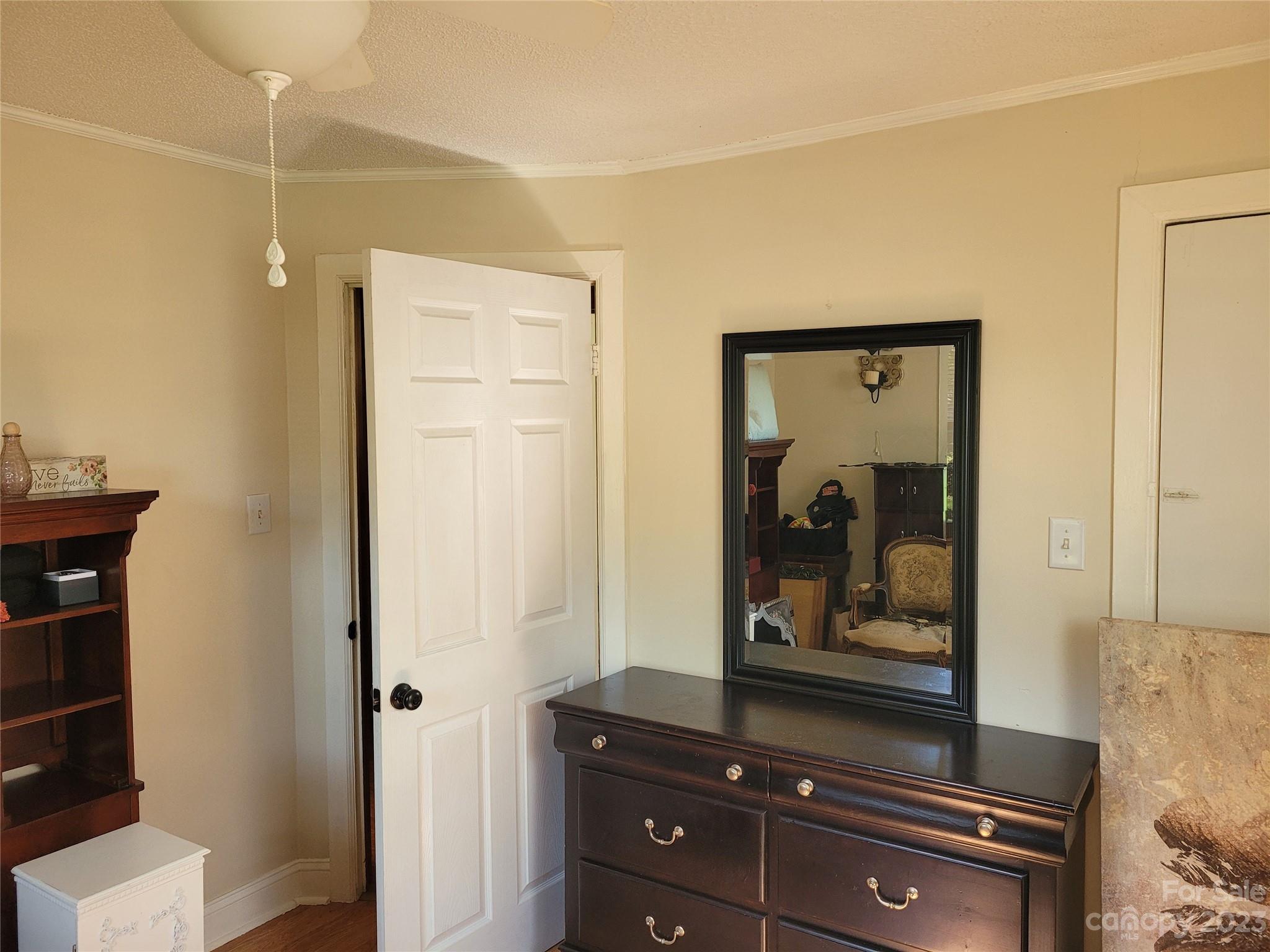 1740 Sells Road Salisbury, NC 28144 - Photo 13 of 22 a room with a mirror and furniture