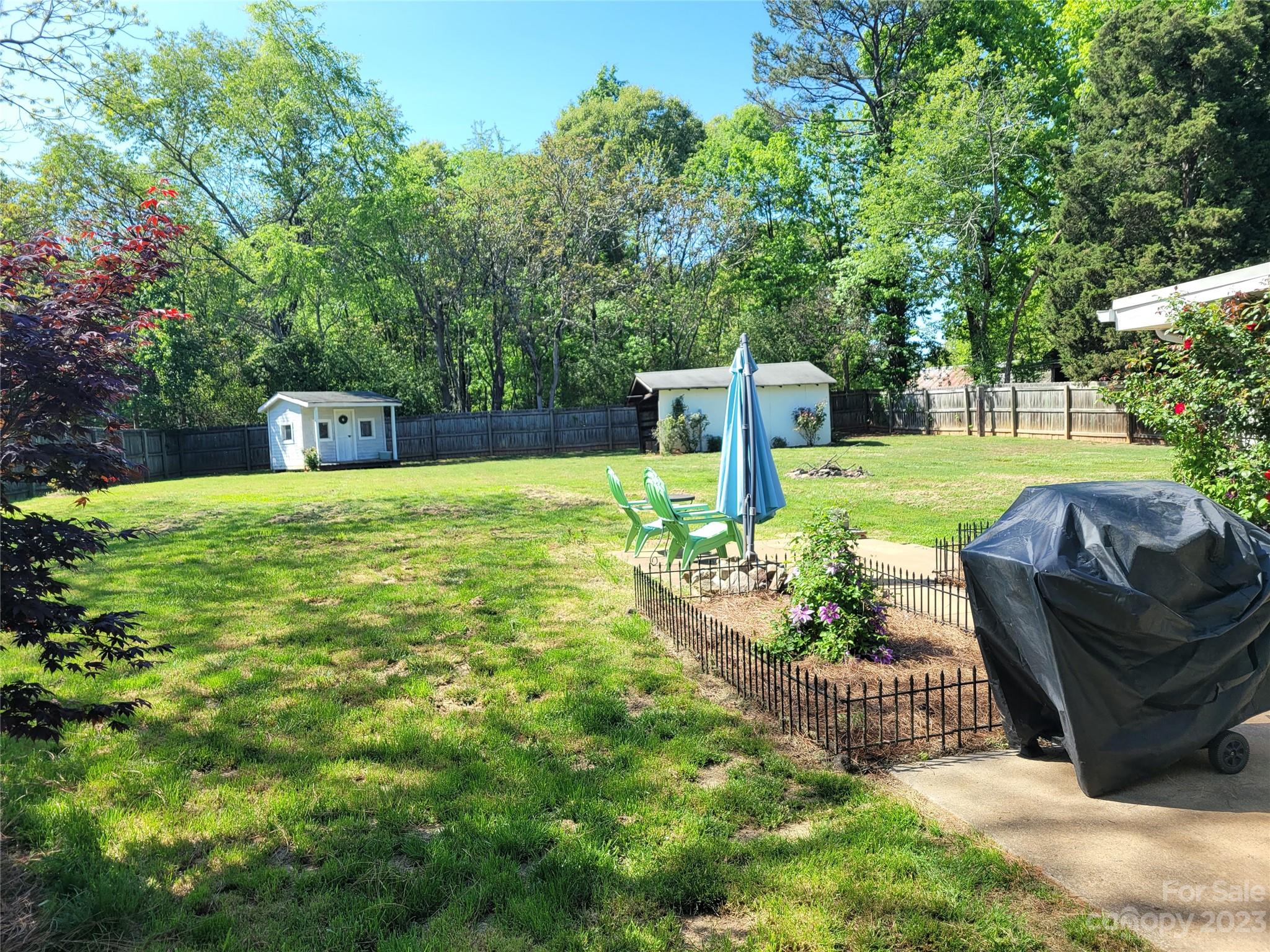 1740 Sells Road Salisbury, NC 28144 - Photo 4 of 22 a view of a garden with plants and a small yard