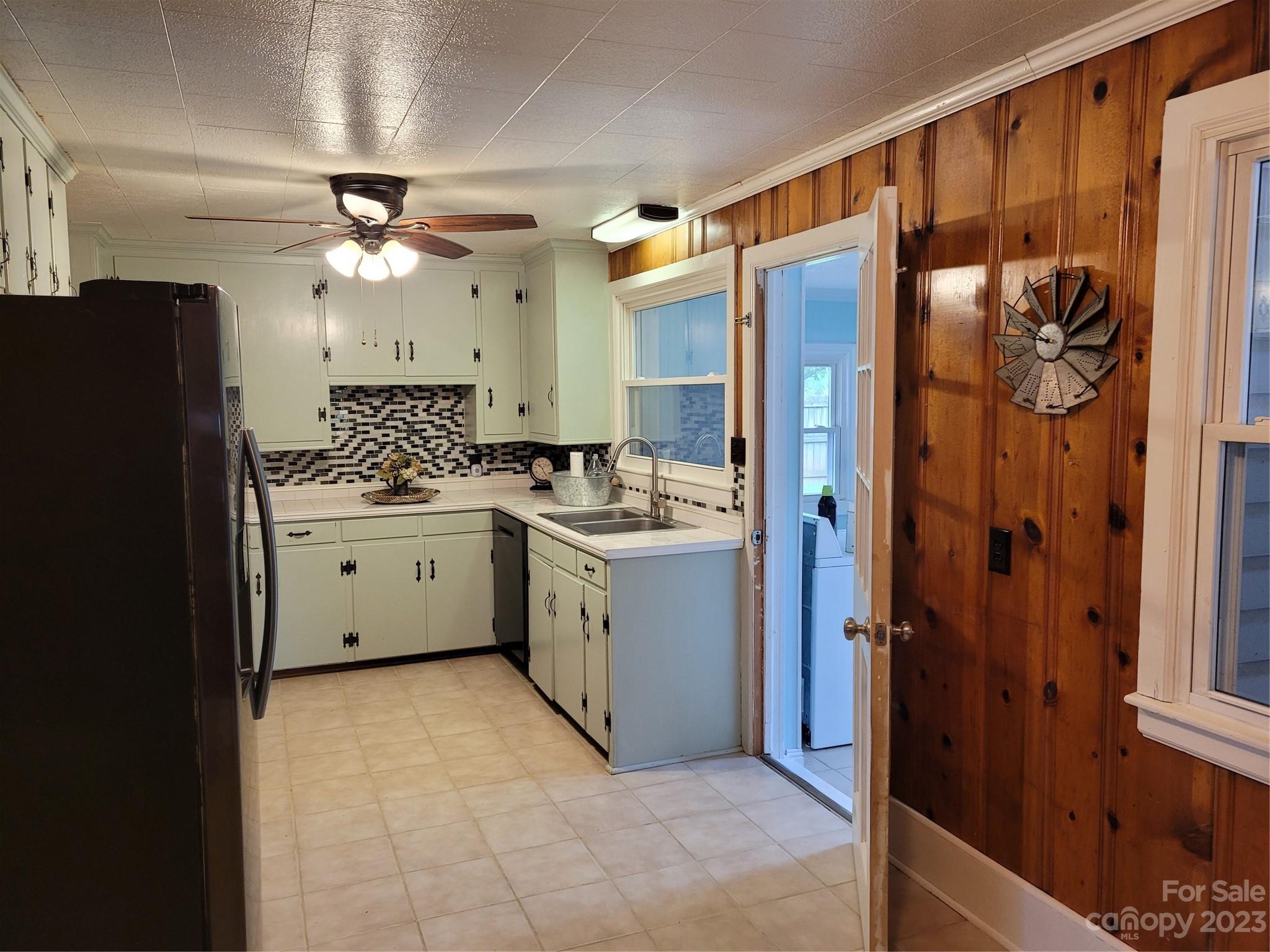 1740 Sells Road Salisbury, NC 28144 - Photo 6 of 22 a kitchen with a refrigerator a sink and cabinets