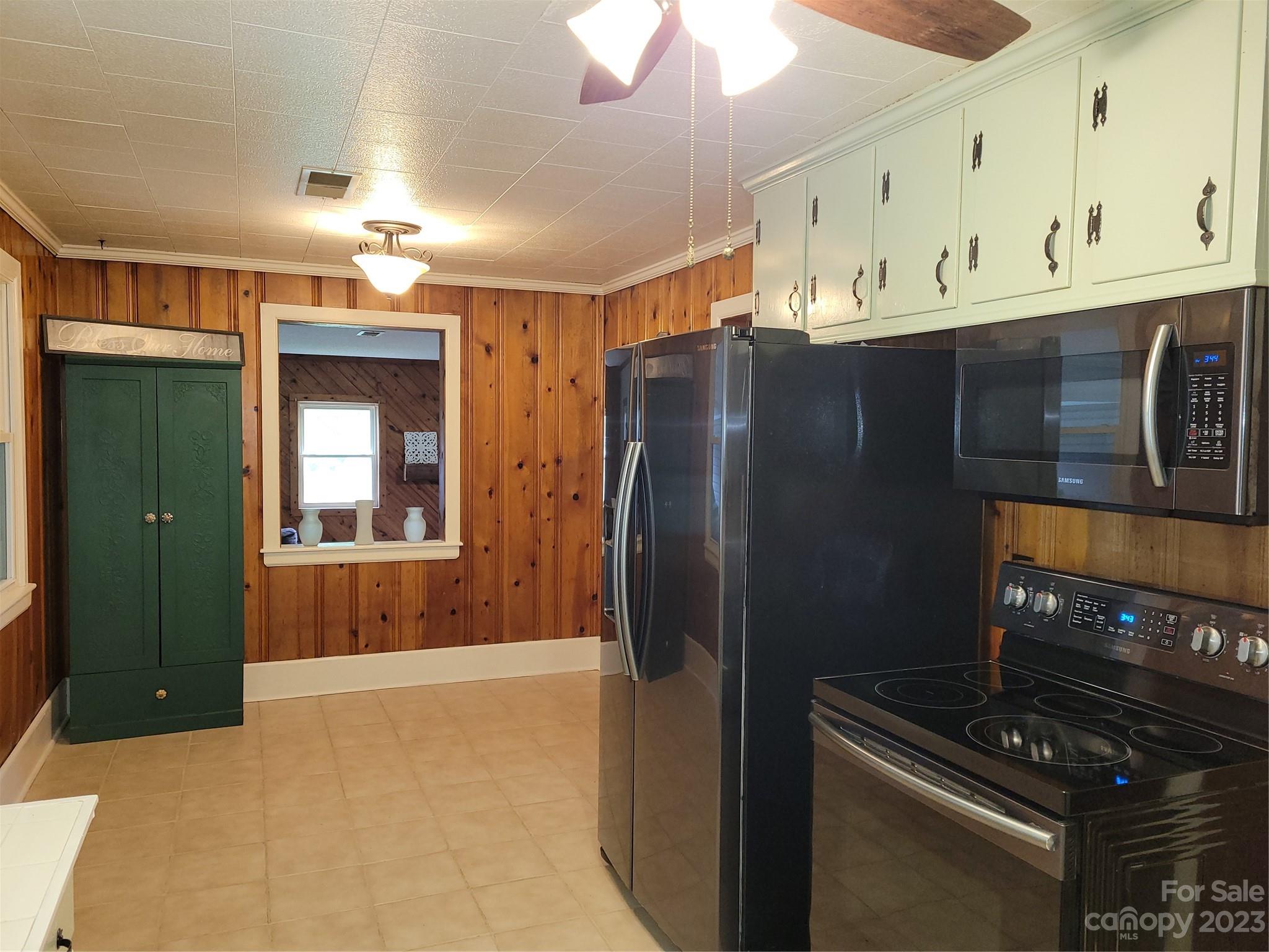 1740 Sells Road Salisbury, NC 28144 - Photo 7 of 22 a kitchen with stainless steel appliances granite countertop a refrigerator and a stove