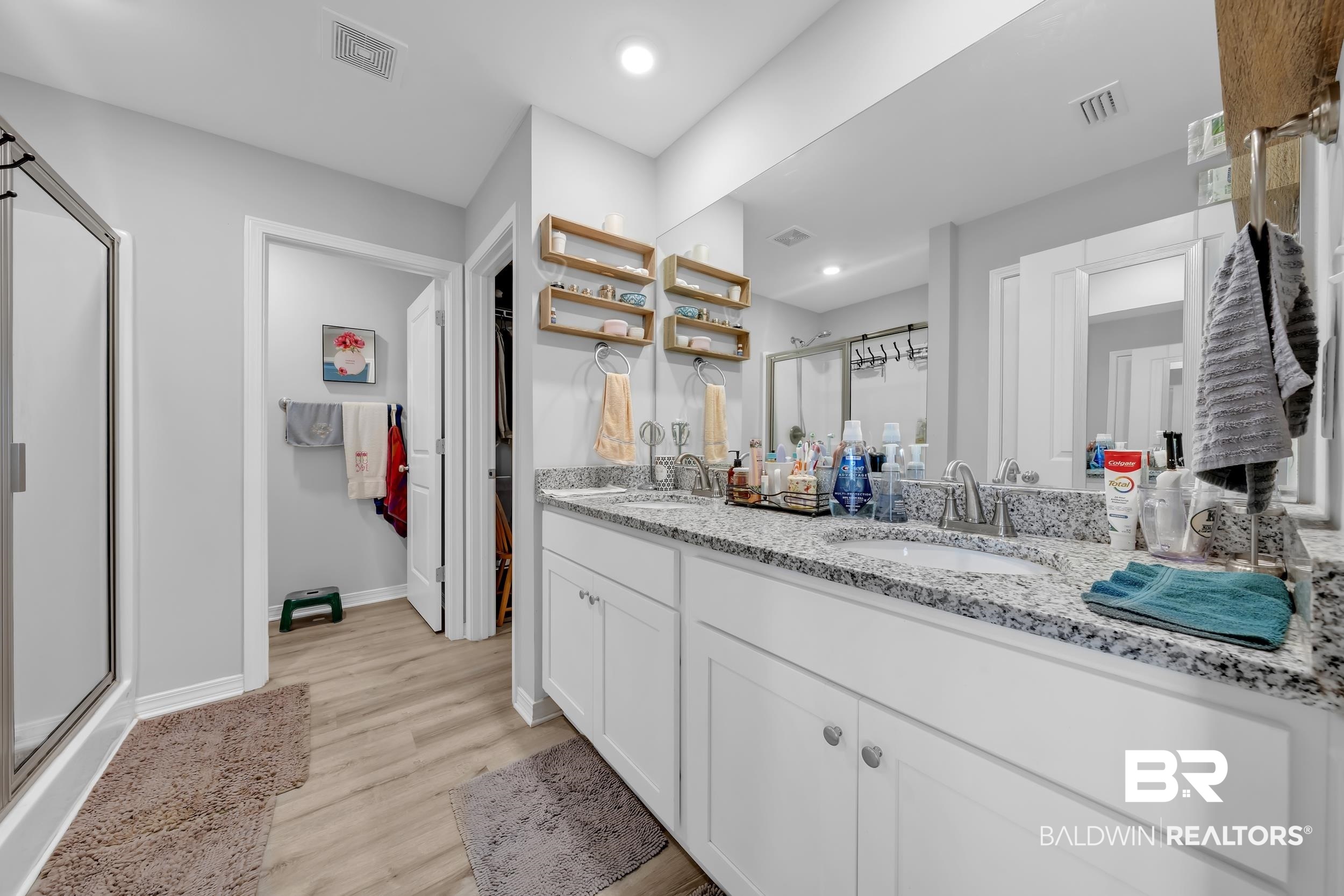 1228 Caper Avenue Foley, AL 36535 - Photo 21 of 54 Double vanity with granite countertop, undermount sinks, and chrome fixtures