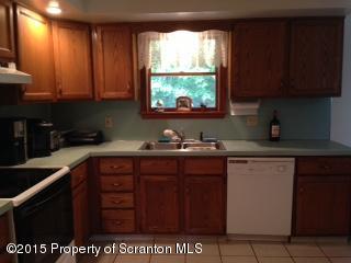 116 Ridgeview Drive Scranton, PA 18504 - Photo 13 of 32 a kitchen with a sink a stove and cabinets