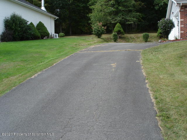 116 Ridgeview Drive Scranton, PA 18504 - Photo 3 of 32 a view of a park with plants and trees
